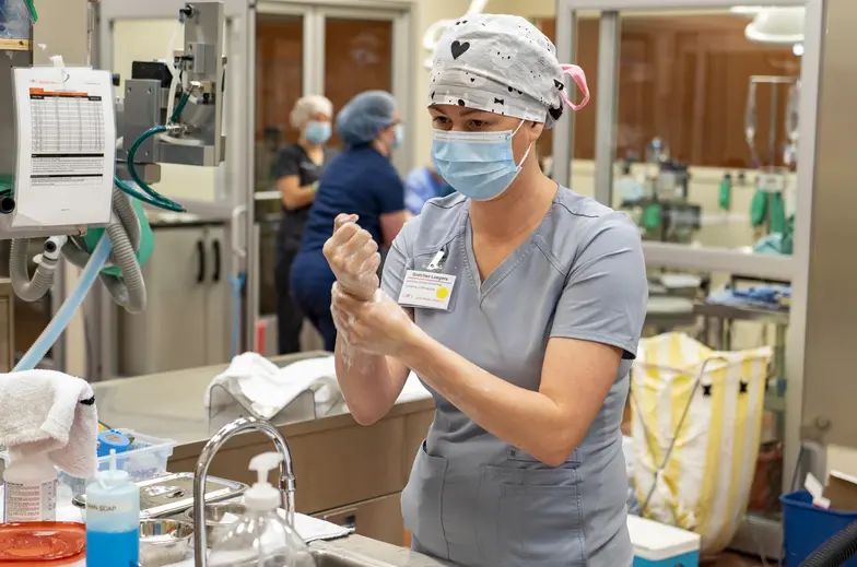 ASNA Externship student washing hands before surgery