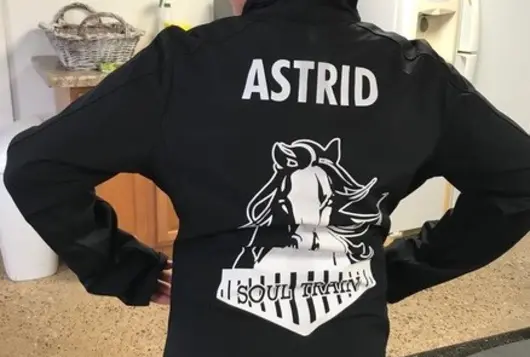 girl wears a soul train jacket